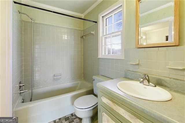 full bathroom featuring tile walls, backsplash, tiled shower / bath combo, vanity, and toilet