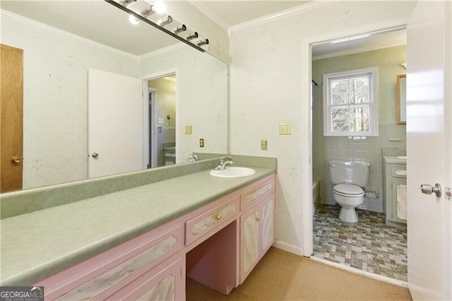 bathroom featuring vanity, crown molding, tile walls, and toilet