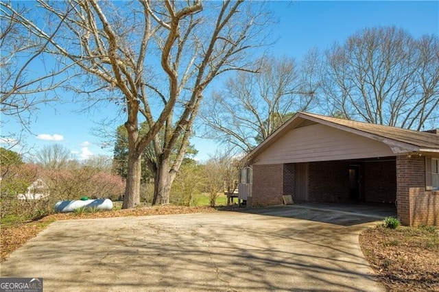 view of side of property featuring a carport