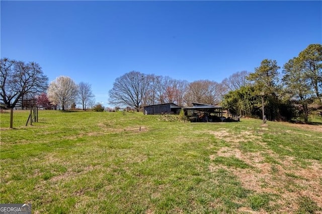 view of yard with a rural view