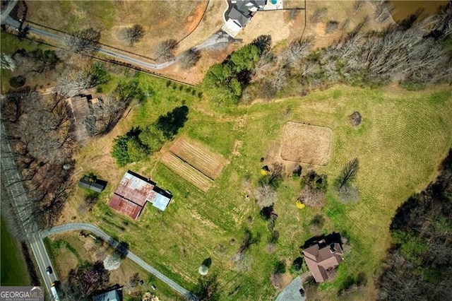 birds eye view of property featuring a rural view