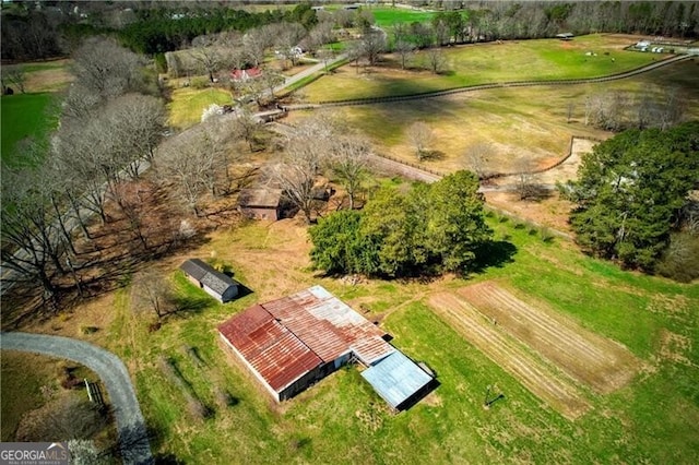 birds eye view of property featuring a rural view