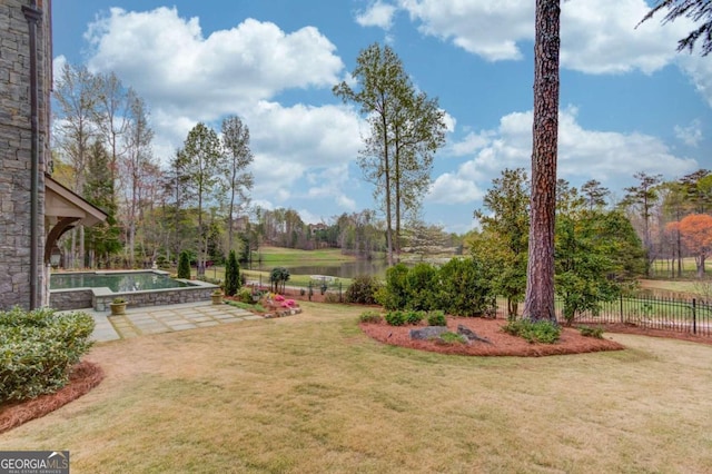 view of yard with a fenced in pool