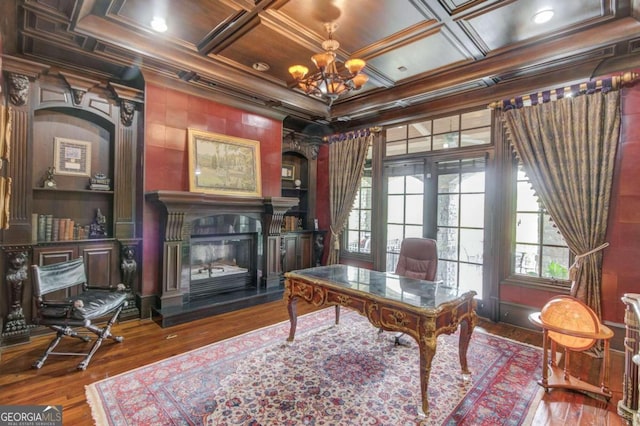 office featuring coffered ceiling, a notable chandelier, french doors, dark wood-type flooring, and crown molding