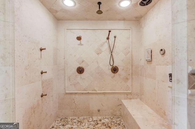 bathroom featuring a tile shower