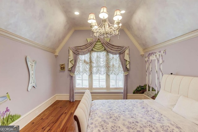 bedroom with hardwood / wood-style floors, a chandelier, ornamental molding, and vaulted ceiling