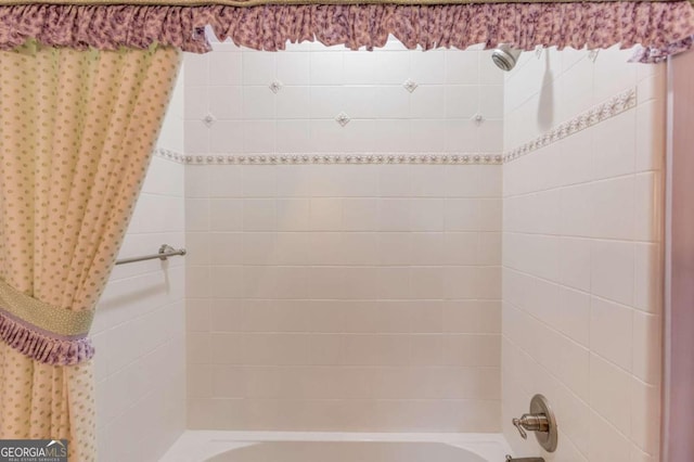 bathroom with shower / bathtub combination with curtain