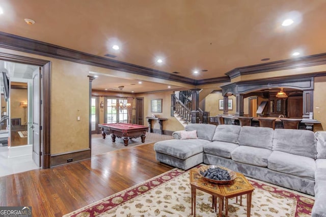 living room with pool table, crown molding, ornate columns, and light tile flooring