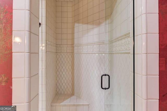 interior details featuring an enclosed shower