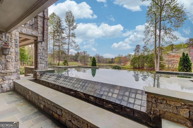 view of patio / terrace with a water view