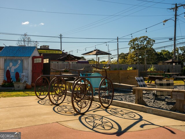 view of patio featuring a storage shed