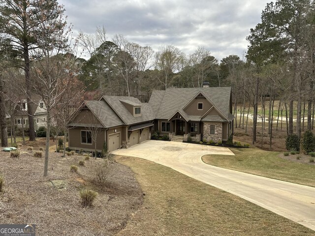 view of front of home with a garage and a front yard