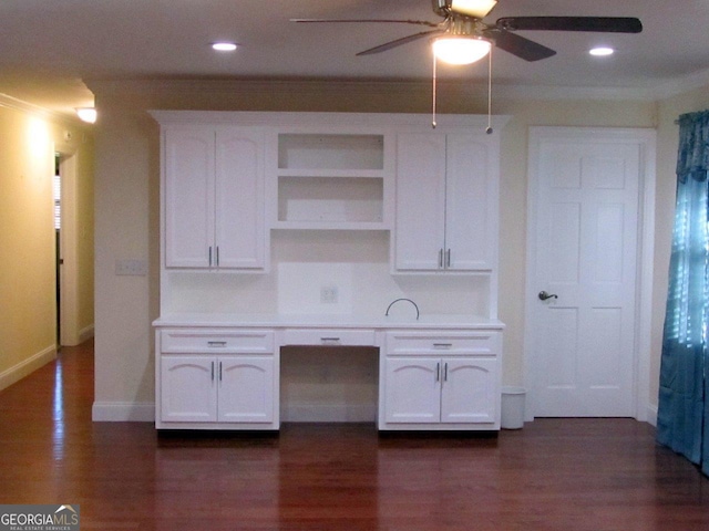 kitchen with dark hardwood / wood-style flooring, white cabinets, and ceiling fan