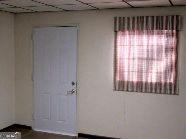 interior space featuring a paneled ceiling