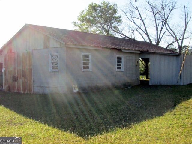 view of home's exterior with a yard