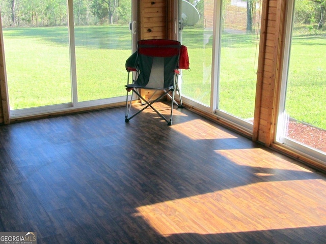 unfurnished sunroom featuring a wealth of natural light