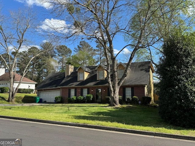 cape cod-style house featuring a garage and a front lawn