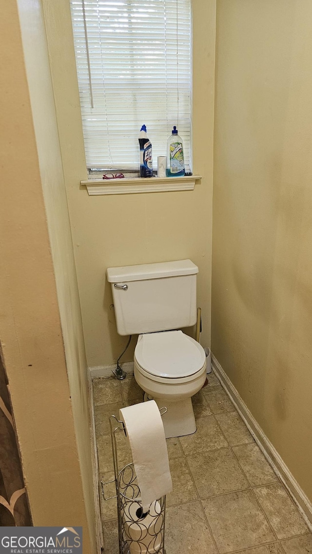 bathroom featuring toilet