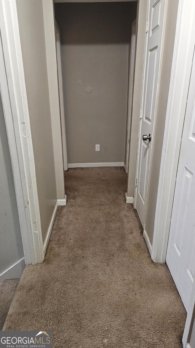 corridor with carpet floors