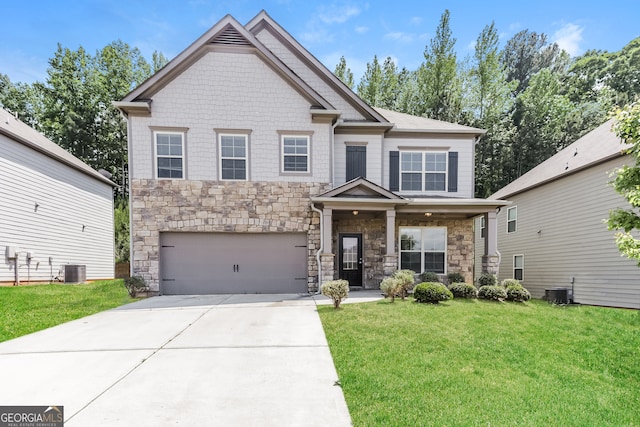 view of front of property featuring a garage and a front lawn