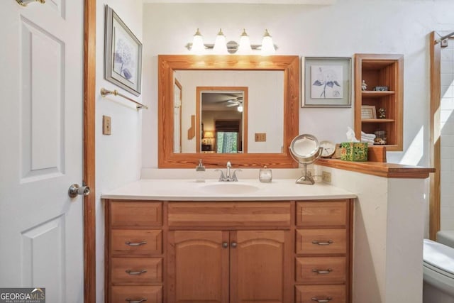 bathroom with vanity, toilet, and walk in shower