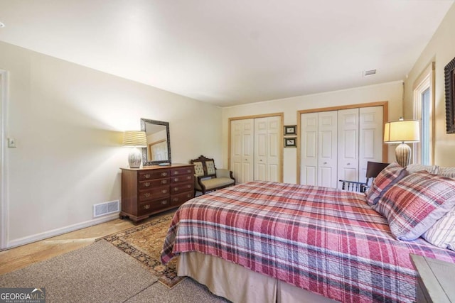 bedroom with multiple closets