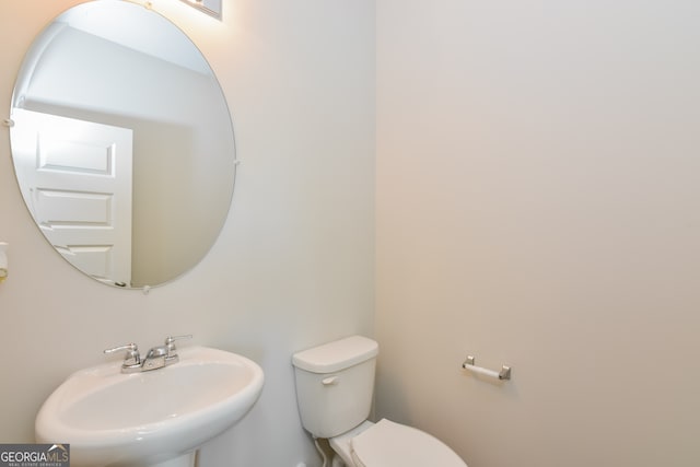 bathroom featuring sink and toilet