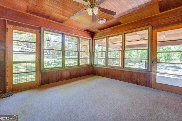 unfurnished sunroom with wooden ceiling and ceiling fan