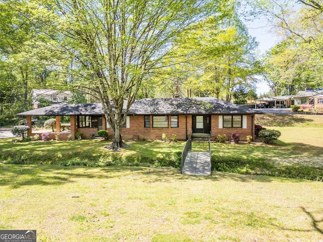 single story home featuring a front yard