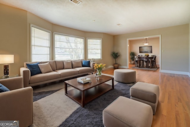 living room with dark hardwood / wood-style floors