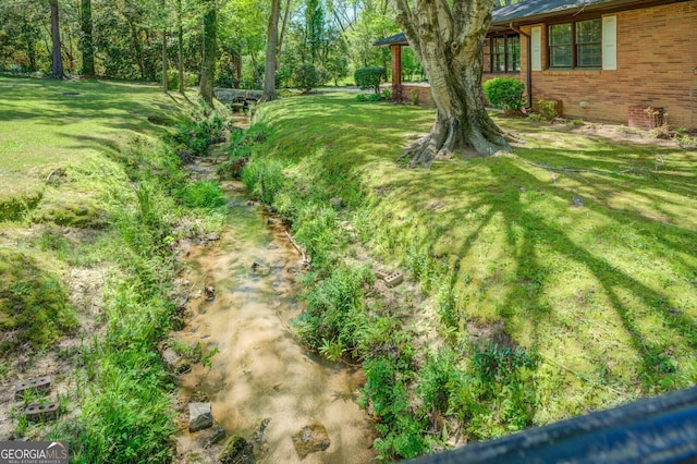 view of yard featuring a water view