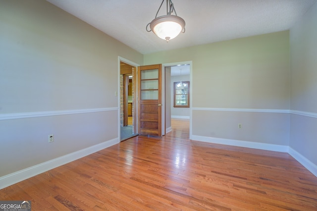 spare room featuring light hardwood / wood-style floors