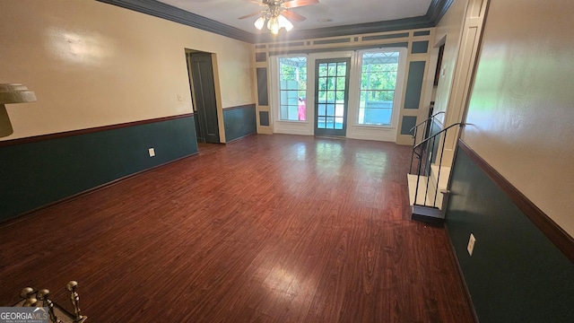 empty room with ceiling fan, crown molding, and dark hardwood / wood-style floors