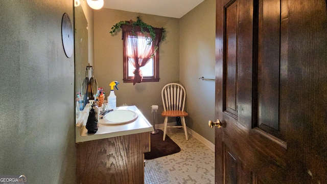 bathroom featuring tile flooring and vanity