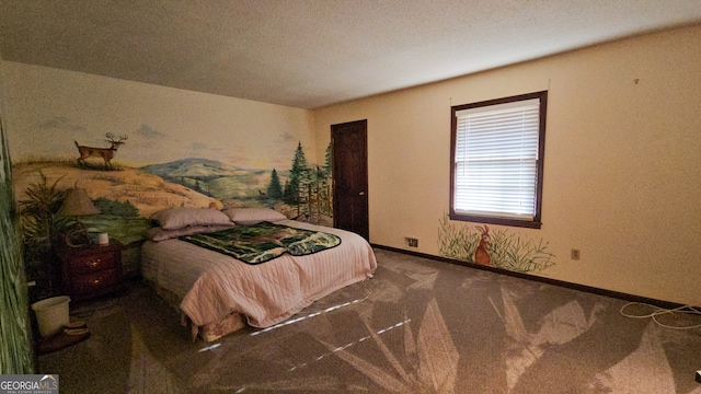 bedroom with dark colored carpet and a textured ceiling