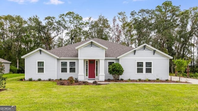 single story home featuring a front yard