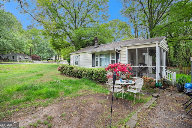 view of yard with a sunroom