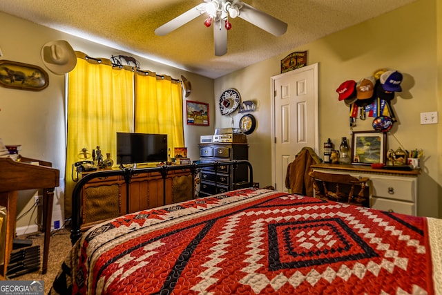 carpeted bedroom with a textured ceiling and ceiling fan