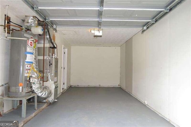 garage featuring heating utilities and water heater