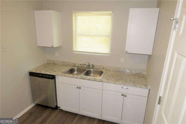 kitchen with white cabinets, light stone countertops, dark hardwood / wood-style floors, sink, and stainless steel dishwasher