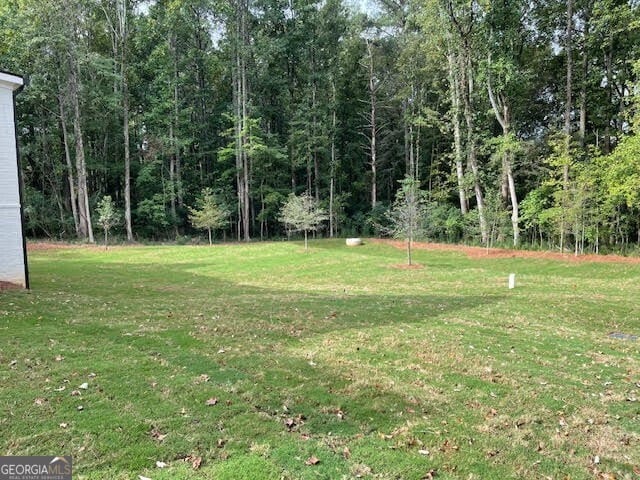 view of front of property with a garage and a front yard