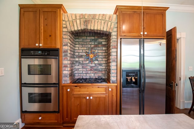 kitchen featuring appliances with stainless steel finishes and ornamental molding