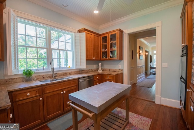 kitchen featuring ornamental molding, light stone countertops, sink, and dark hardwood / wood-style flooring