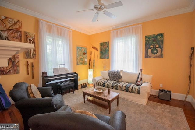 living room featuring ornamental molding, ceiling fan, hardwood / wood-style flooring, and plenty of natural light