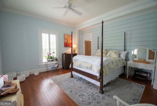 bedroom with crown molding, hardwood / wood-style flooring, and ceiling fan