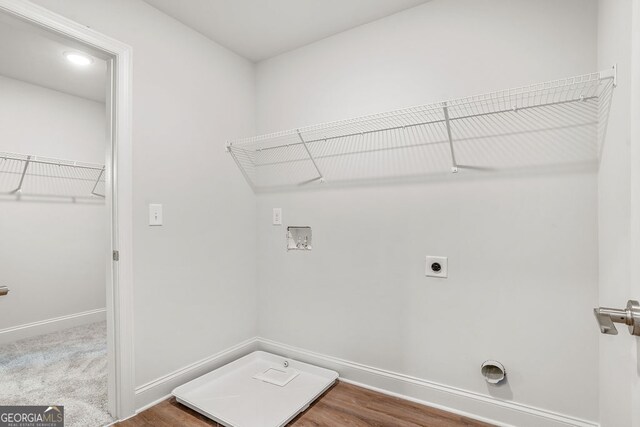 laundry area featuring washer hookup, hookup for an electric dryer, and hardwood / wood-style flooring