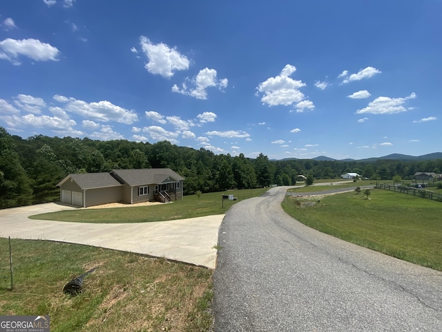 view of road with a mountain view and a rural view