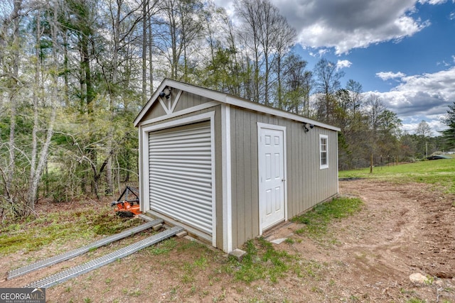 view of outbuilding featuring a garage