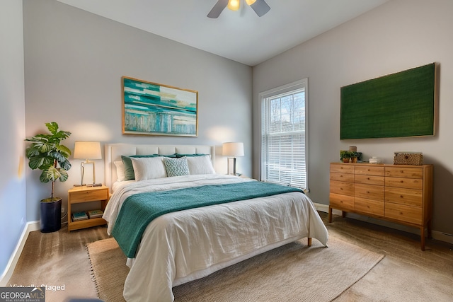 bedroom featuring ceiling fan and carpet