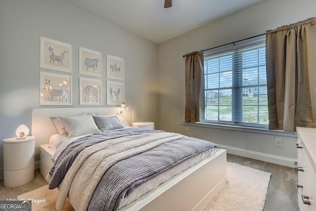 carpeted bedroom with ceiling fan